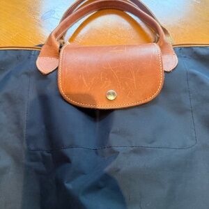 Longchamp Black and Brown Travel Bag with Foldable Design